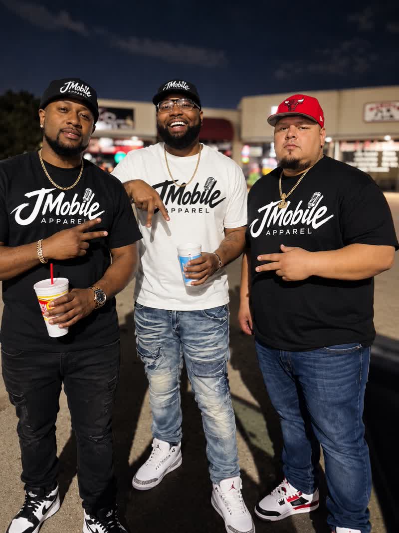 Three customers wearing JMobile Apparel tees and caps